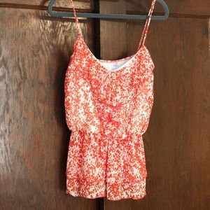 Adorable orange patterned peplum tank!